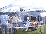 Kiwanis, with their usual charitable spirit, served hot dogs and beverages to participants in the ALS Walk at the S&R Club, all for free. Kiwanians at the booth are Al Kastner [back to camera],Al Levi