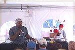 A representative of Phillips Restaurants explains how to make GBDs.  [Golden, Brown and Delicious crabcakes] at Harbor Day in W. Ocean City.