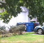 Trash cans are now stored in front of homes all over OP.