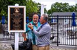 Plaque installed next to Tiki Bar expansion at Yacht Club. Photo courtesy of OPA. May 2024.