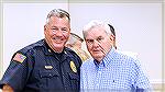 OPA Police Chief Tim Robinson and his dad Fred pose for a picture during the 2024 OPA Annual Meeting of the Membership on 8/10/2024. Fred Robinson is also a member of the Ocean Pines Elections Committ