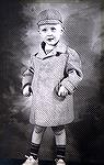 Joe Reynolds in Little Lord Fauntleroy outfit around age 2.